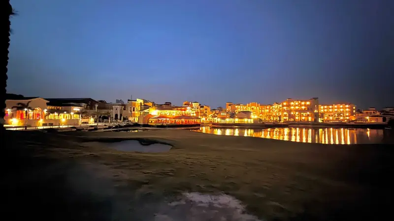 Onsite resort lake lit up in the evening