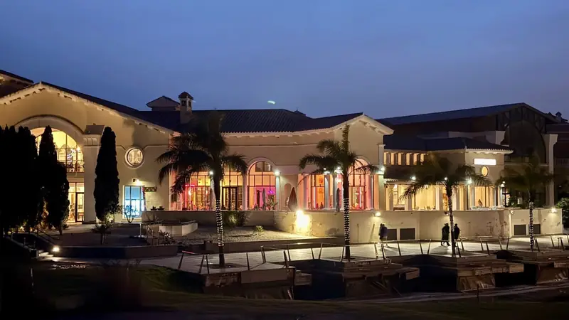 La Torre golf clubhouse illuminated against the night sky